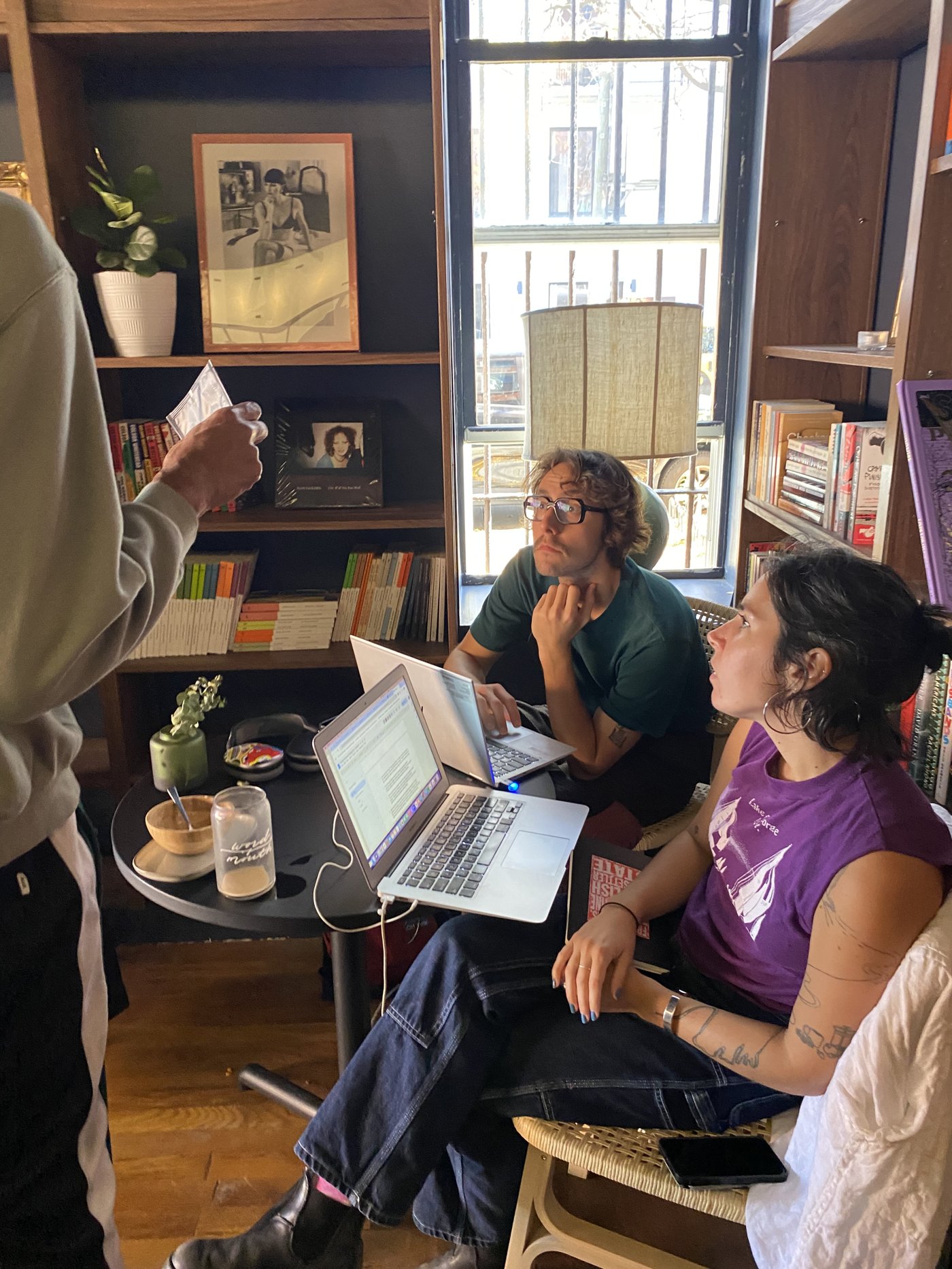 Inside Cordelia bookstore, guests seated among the shelves